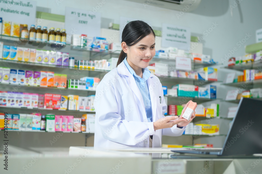 Female pharmacist counseling customer via video call in a modern pharmacy drugstore.