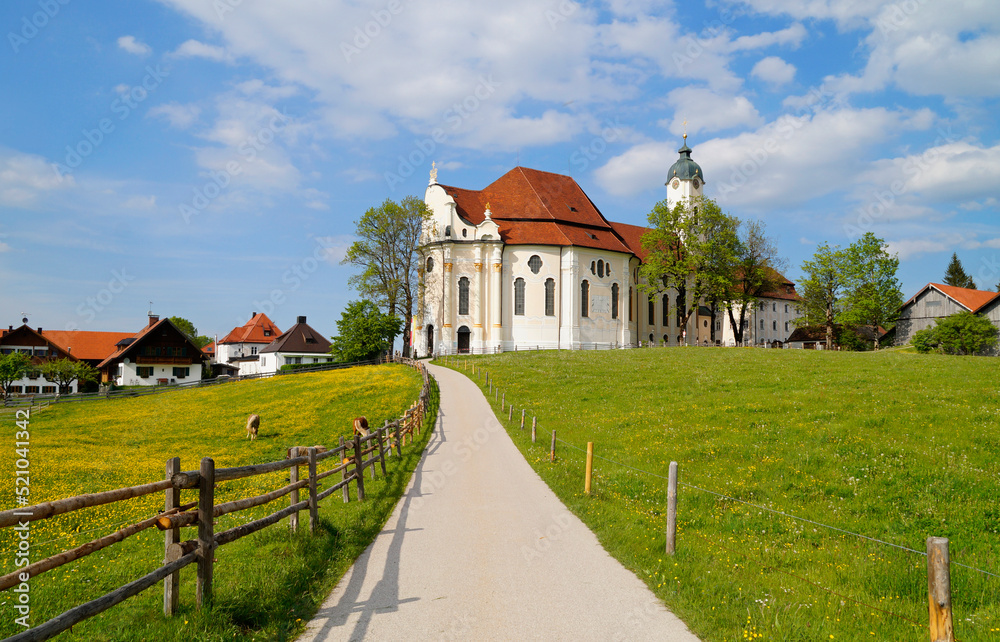 The Pilgrimage Church of Wies (German: Wieskirche) is an oval rococo church in the Bavarian Alps on a sunny day in May (Steingaden, Weilheim-Schongau district, Bavaria, Germany)