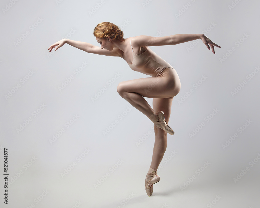 charming ballerina posing in the studio on a white background charming ballerina posing in the studio on a white background