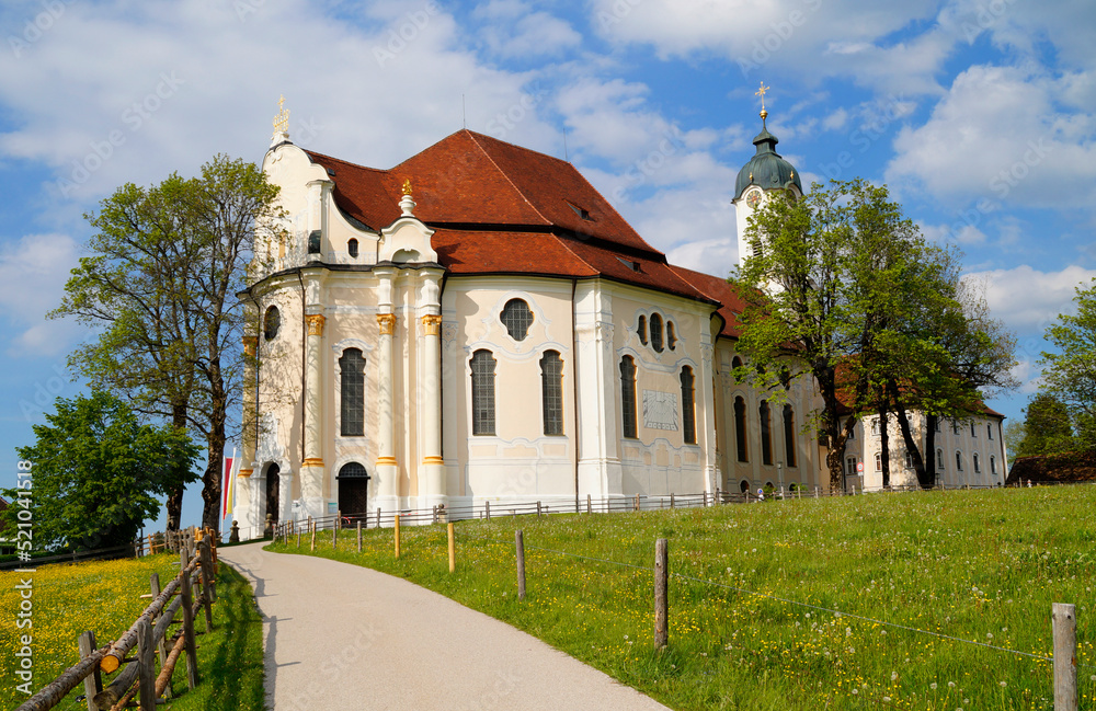  The Pilgrimage Church of Wies (German: Wieskirche) is an oval rococo church in the Bavarian Alps on a sunny day in May (Steingaden, Weilheim-Schongau district, Bavaria, Germany)