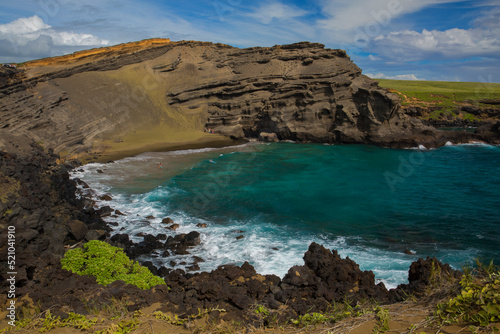 Stunning view of Green Sand Beach - in a bay cut into the side of an ancient cinder cone - on the Big Island of Hawaii. 