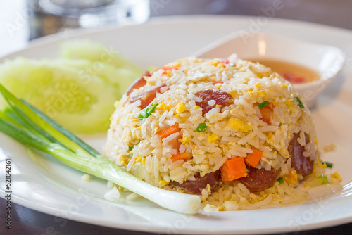 Chinese sausage fried rice in a white plate