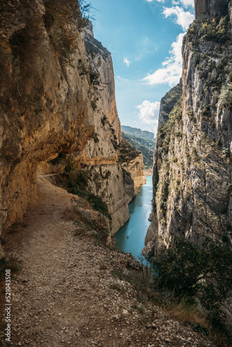 Hiking on Great Route, Footpath carved on the rock of Montrebei Gorge or Congost de Mont-rebei, Lleida, Catalonia, Spain