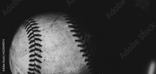 Old texture of used game ball for sport in black and white, copy space on banner background.