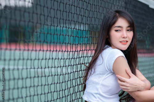 Hipster asian girl pose for take a photo Fashion portrait pretty woman at tennis court lifestyle of modern teenage thai girl