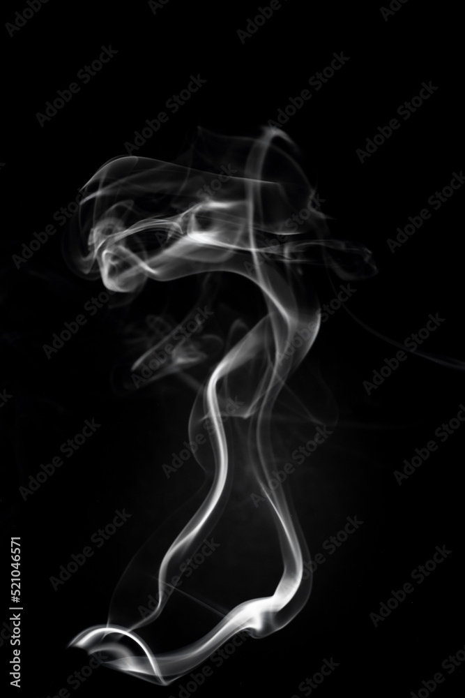 A single white smoke burn from incense, shot in studio with dark black background, for design and religion concept