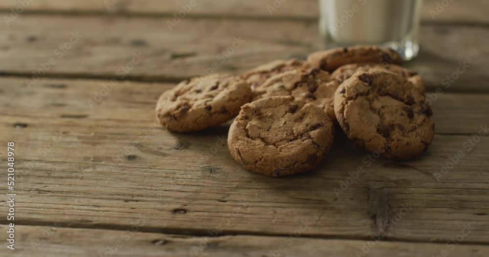 Video of biscuits with chocolate and milk on wooden background Video of biscuits with chocolate and milk on wooden background