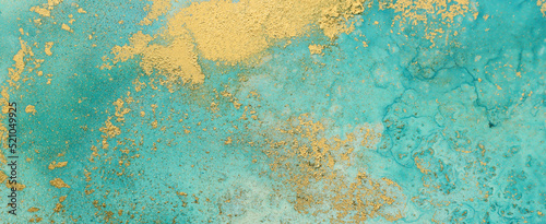 art photography of abstract fluid painting with alcohol ink  blue and gold colors