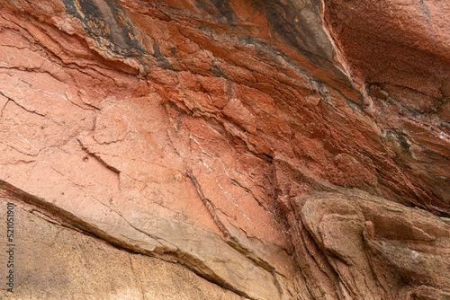 rocks with faults and winding sediments, on a beach in northern Spain, in asturias,