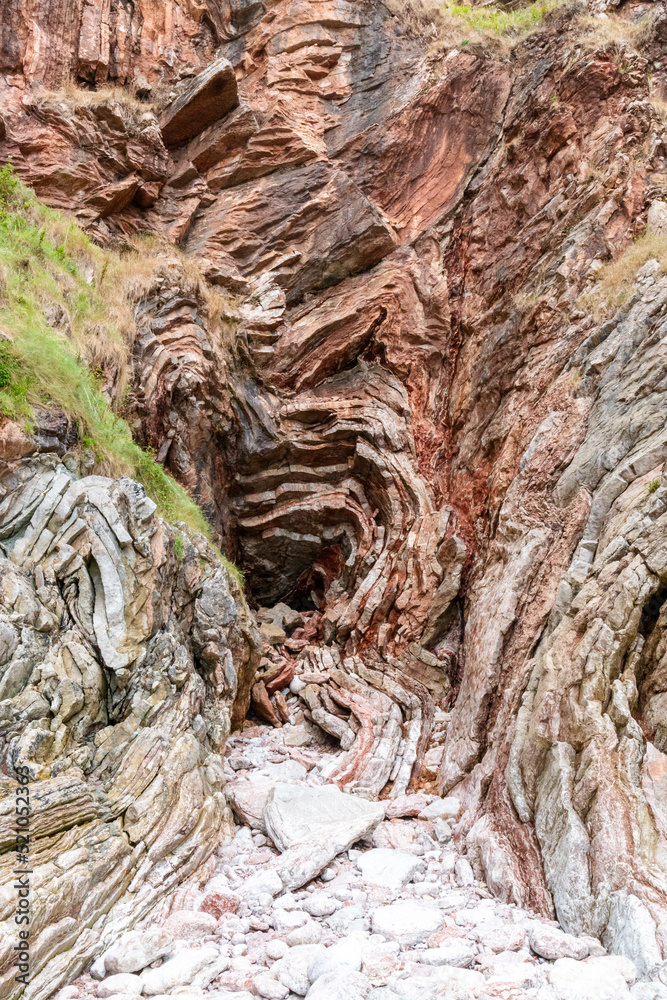 rocks with faults and winding sediments, on a beach in northern Spain, in asturias, rocks with faults and winding sediments, on a beach in northern Spain, in asturias,