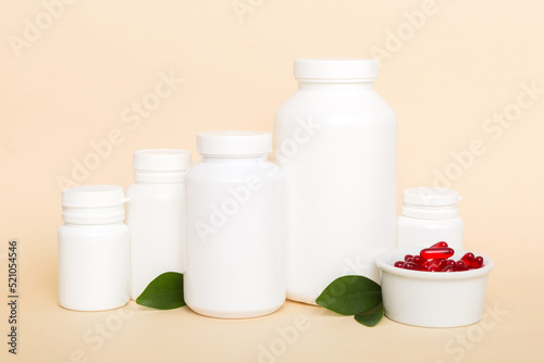 different drugs and health supplement pills with medicine bottle health care and medical top view. Vitamin tablets. Bottle with colored pills on table background. Multivitamins