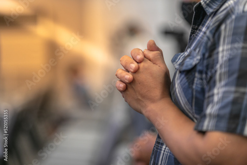 Blur praying in the church Praise Jesus