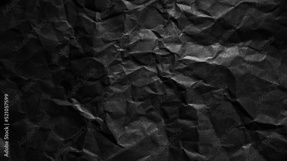 Textured crumpled black paper background. Textured crumpled black paper background.