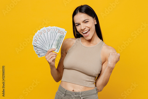 Fotografie Young happy fun cool latin woman 30s she wearing basic beige tank shirt holding