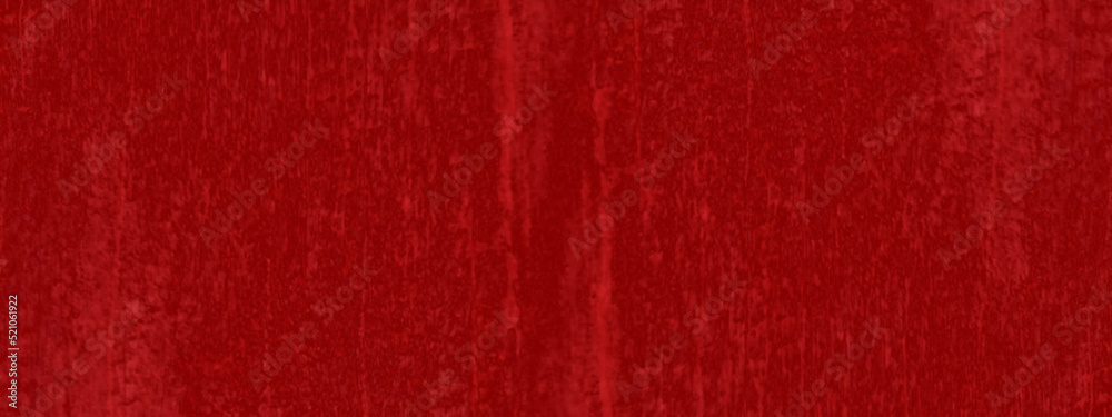 Abstract grunge cracked and scratched style decorative red texture, grainy and bright shinny red paper texture, red painted background with distressed vintage grunge texture and space for text.