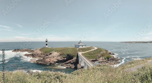 Nice view of the lighthouse of the town of Ribadeo during the day, as one of the most touristic natural environments of Gallicia. photo