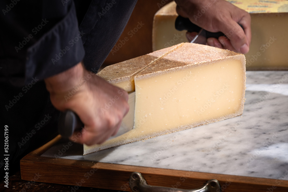 Famous and tasted part of cheese ha sbeen cuted with a wire Famous and tasted part of cheese ha sbeen cuted with a wire