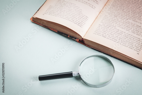 magnifier and book on the table