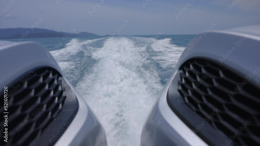 Boat out board engines shooting between the two engines with flushing