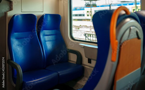 Blue seats in a modern electric train.