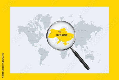 Map of Ukraine on political world map with magnifying glass