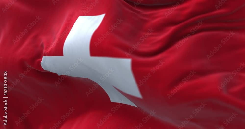 Close-up view of the swiss national flag waving in the wind