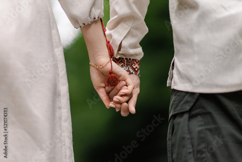 young couple holding hands. close up photo