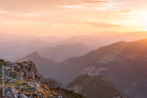 Fototapeta Naklejka Na Ścianę i Meble -  Sunset from the summit of the beautiful mountain peak.