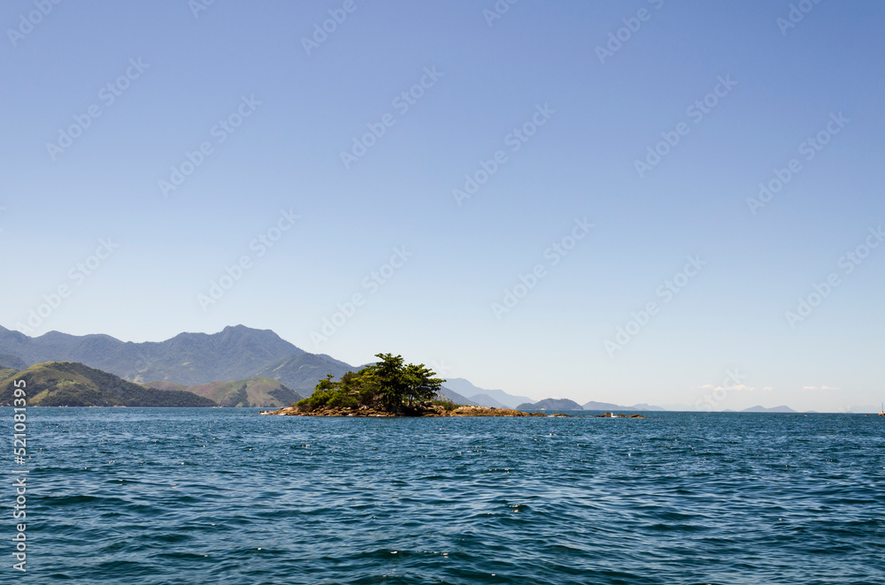 Tropical island in the sea at the coast of Angra dos Reis town, State of Rio de Janeiro, Brazil. Taken with Nikon D5100 18-55 lens, at 24mm, 1/400 f 10 ISO 100. Date: Mar 16, 2014