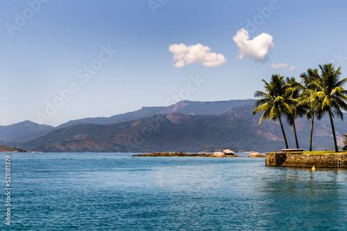 Island in the sea and palm trees at Angra dos Reis town, State of Rio de Janeiro, Brazil. Taken with Nikon D5100 18-55mm lens, at 44mm, 1/320 f 9.0 ISO 100. Date: Mar 16, 2014 photo