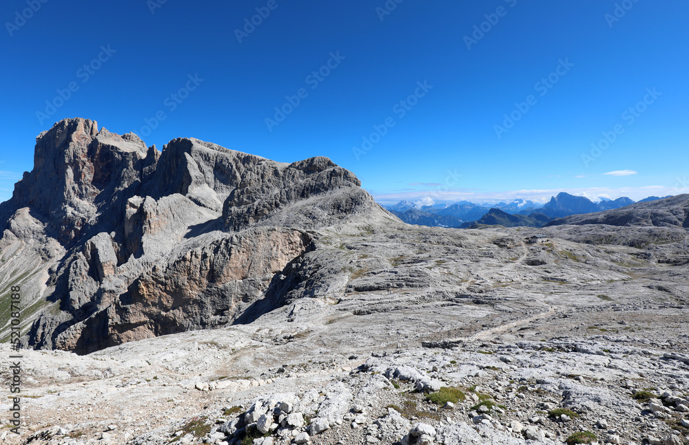 incredible breathtaking mountain landscape in the Dolomites on Mount Rosetta which looks like the lunar surface and an alpine refuge in the middle
