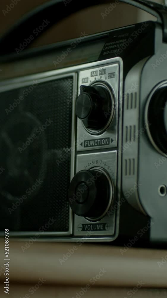 A  silver and black retro radio