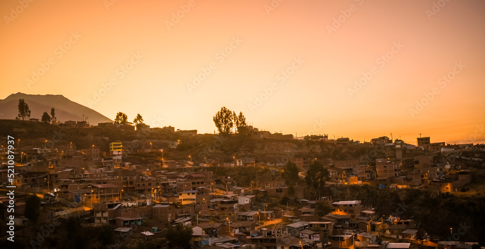 houses and trees in mountain at dawn, cusco, peru