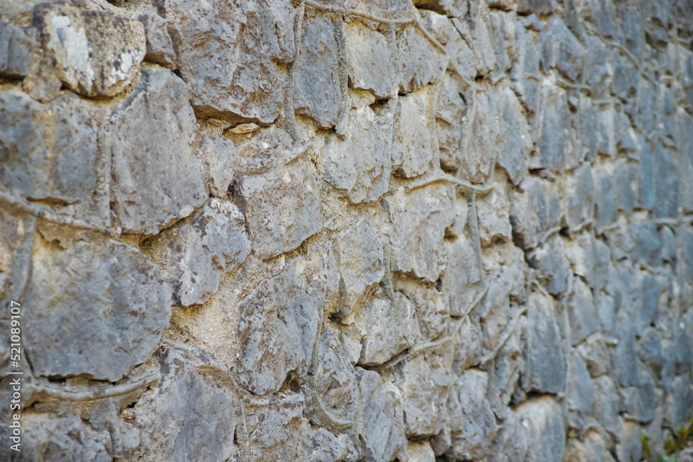 The wall is gray.Abstract background.The texture of a stone wall. A stone wall.