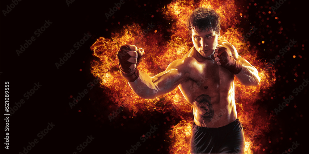 Fighter man punching in fire. MMA fighter