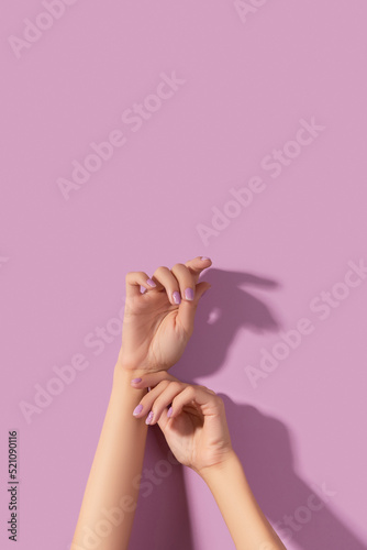 Leinwand Poster Womans hands with trendy lavender manicure