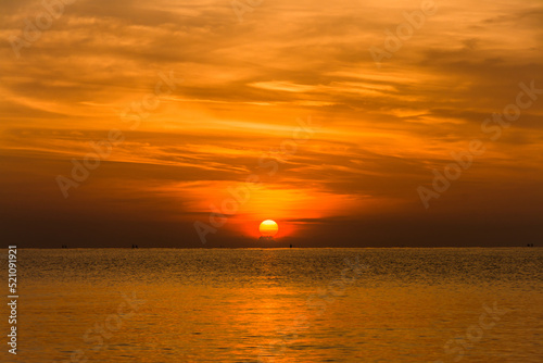 Fototapeta Naklejka Na Ścianę i Meble -  sunset sky with dramatic sunset clouds over the sea. Beautiful sunrise over Ocean