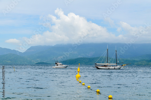 Boats on the sea at the coast of Angra dos Reis town, State of Rio de Janeiro, Brazil. Taken with Nikon D5100 
 18-200 lens, at 52mm, 1/320 f 9.0 ISO 100 photo