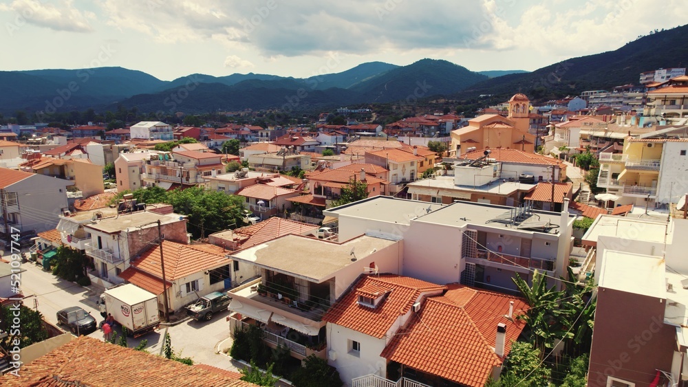 Orange rooftops of the village of Sarti in Greece. Aerial view. Typical Greek scenery. Summer holidays destinations. High quality photo