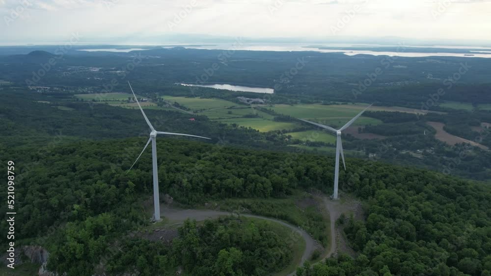 Wind Turbines with Lakes and Farmland in the distance. Wind Turbines with Lakes and Farmland in the distance.