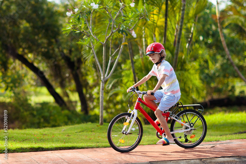 Kids on bike. Child on bicycle. Kid cycling. © famveldman