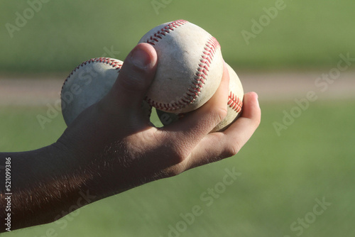 Three Baseballs in Hand