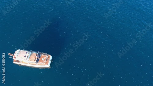 Small Yacht surrounded by swarm of jellyfish, Mediterranean, aerial
Drone view from mediterranean, israel, 2022 

 photo