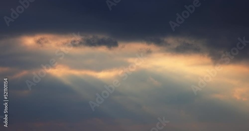 Wallpaper Mural Sunbeams shining through moving dramatic white clouds. Dramatic cloudy blue sky and warm sunrise or sunset illumination, 4K video. Time lapse, peaceful, hope, religion, spiritual, nature. Torontodigital.ca