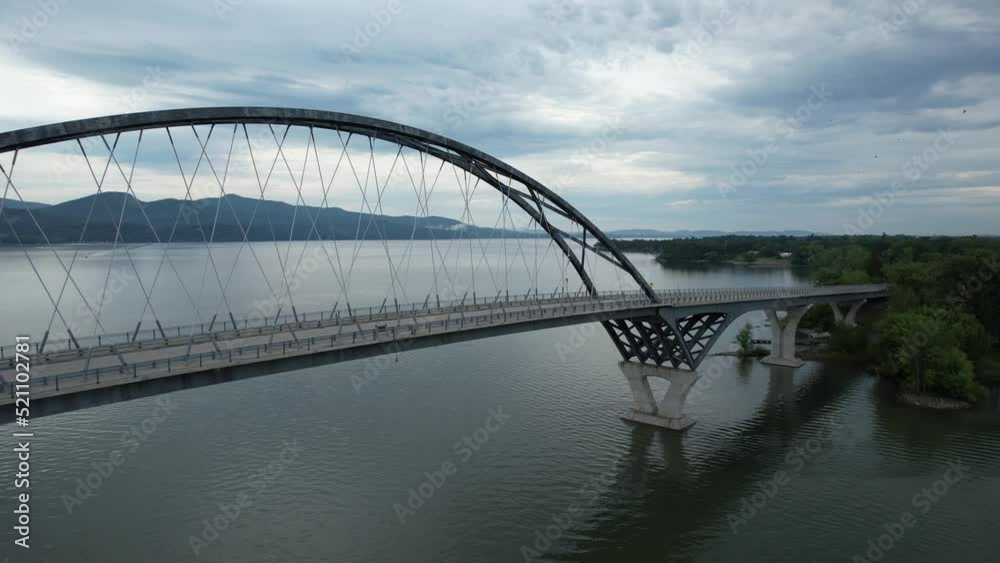 Sweeping drone shot of a bridge over Lake Champlain. Sweeping drone shot of a bridge over Lake Champlain.