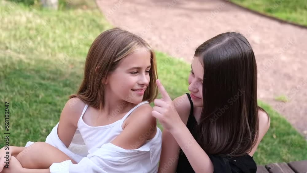 happy and lucky to have a sister. two girls outdoors in black and white clothes. good and bad. obedient and harmful. fraternal twins teen sisters happy and lucky to have a sister. two girls outdoors in black and white clothes. good and bad. obedient and harmful. fraternal twins teen sisters