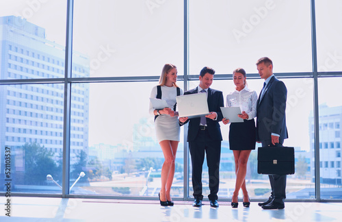 Group of business people doing presentation with laptop during meeting. Group of business people