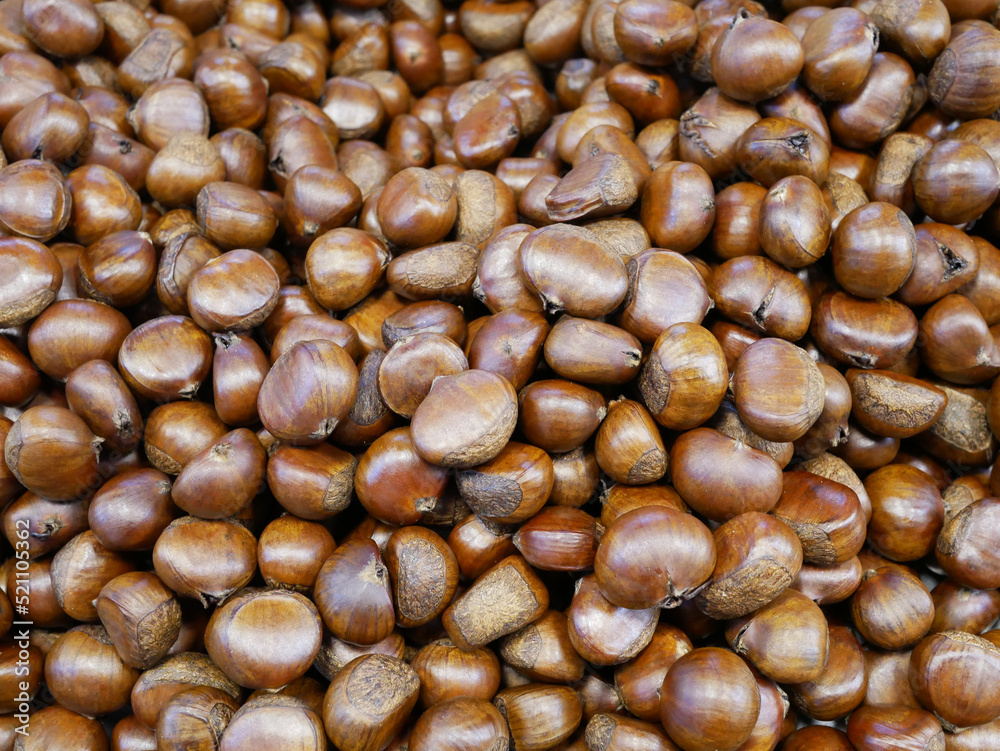 Pile of chestnuts for sale on street food. Pile of chestnuts for sale on street food.