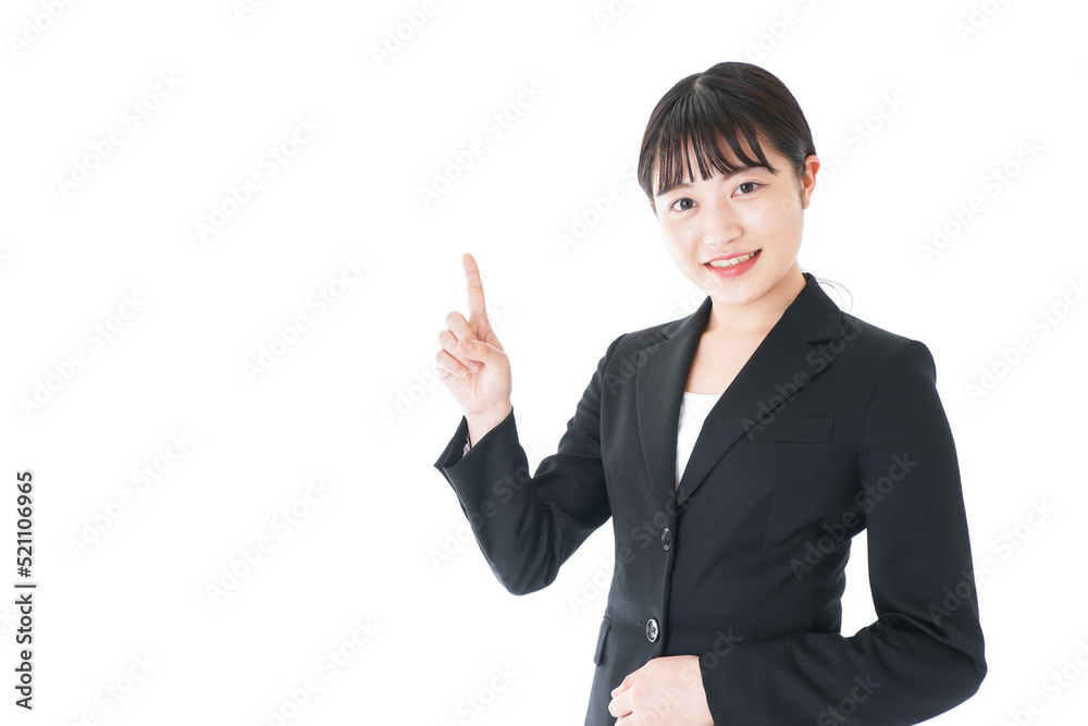 Businesswoman wearing a suit pointing to something Businesswoman wearing a suit pointing to something