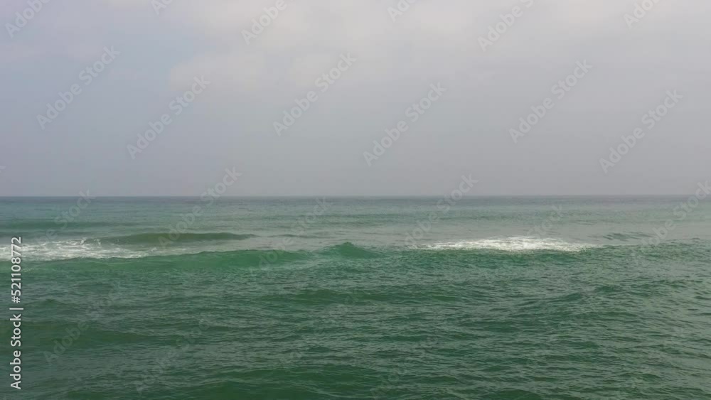 Surface of blue ocean with waves and blue sky with cloud, aerial view. Water cloud horizon background. Surface of blue ocean with waves and blue sky with cloud, aerial view. Water cloud horizon background.